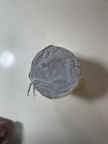 Glass Speaker with a Plastic Top connected to wires and a homemade speaker